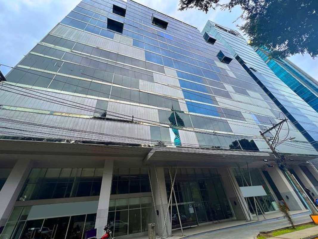 Glass facade of PH Office One tower centrally located on Calle 50 Obarrio Panama City