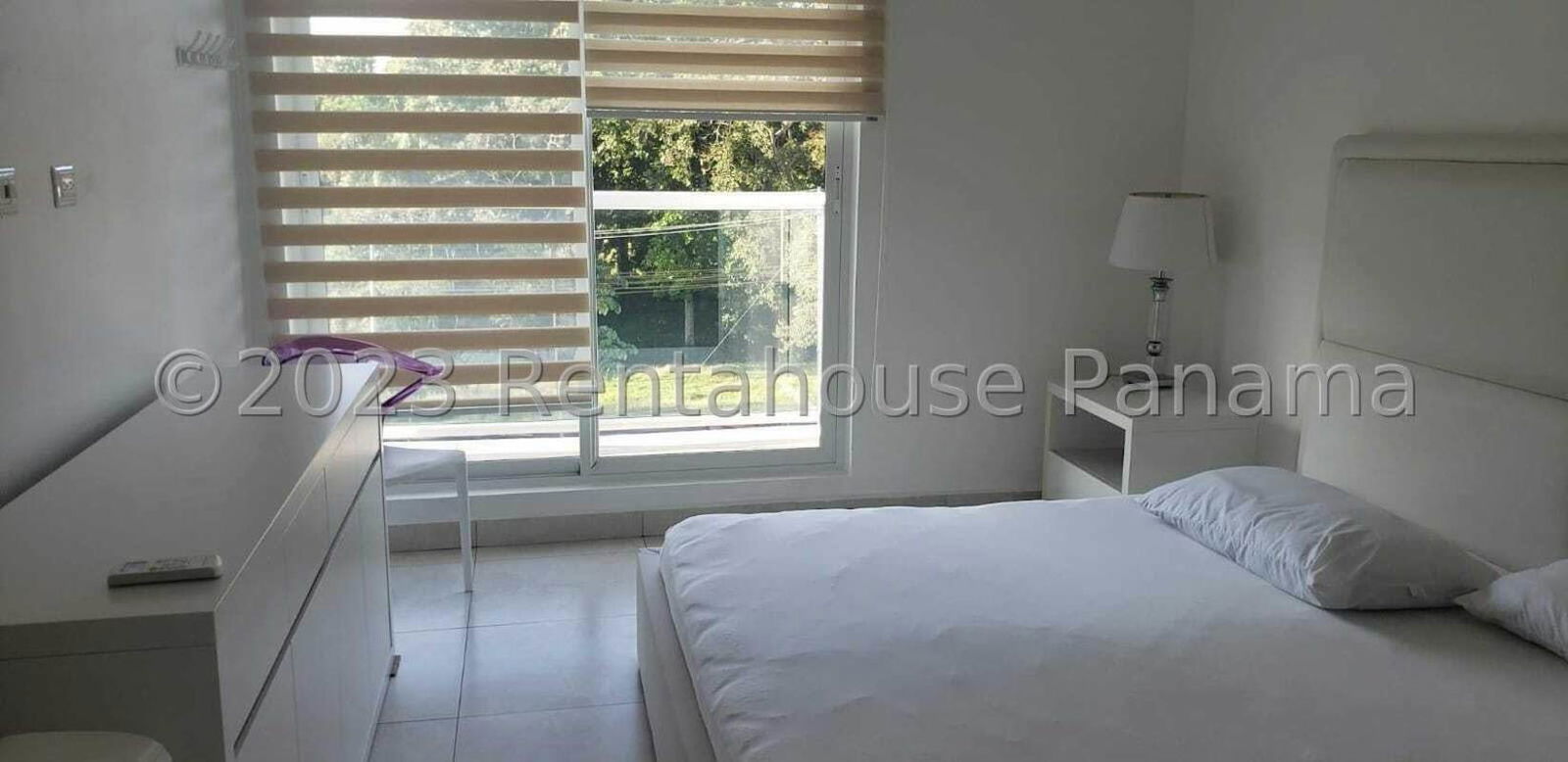 Master bedroom with AC, large window overlooking greenery, walk-in closet at PH Garden City Clayton Panama