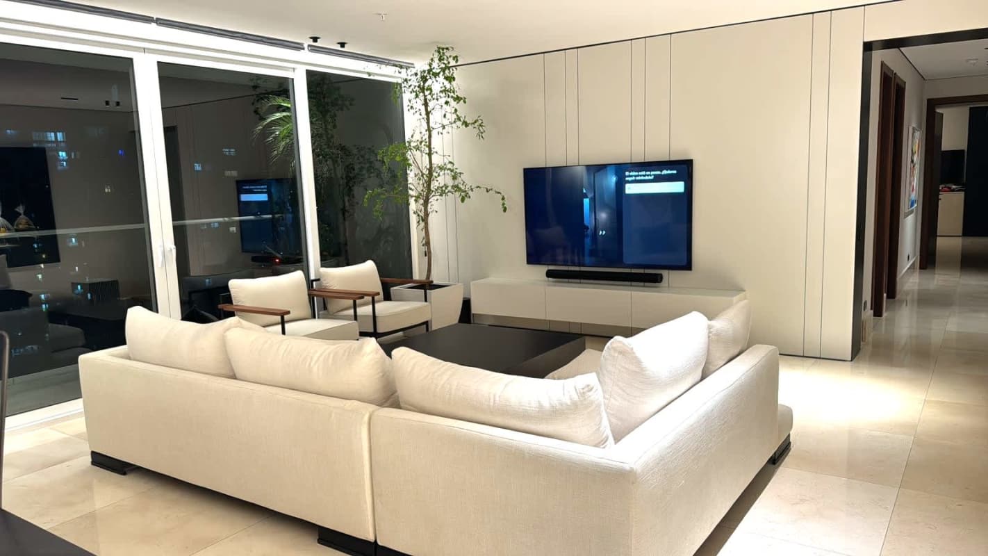 Living room with marble floor, floor-to-ceiling windows city view at PH Wind Rose Coco del Mar Panama