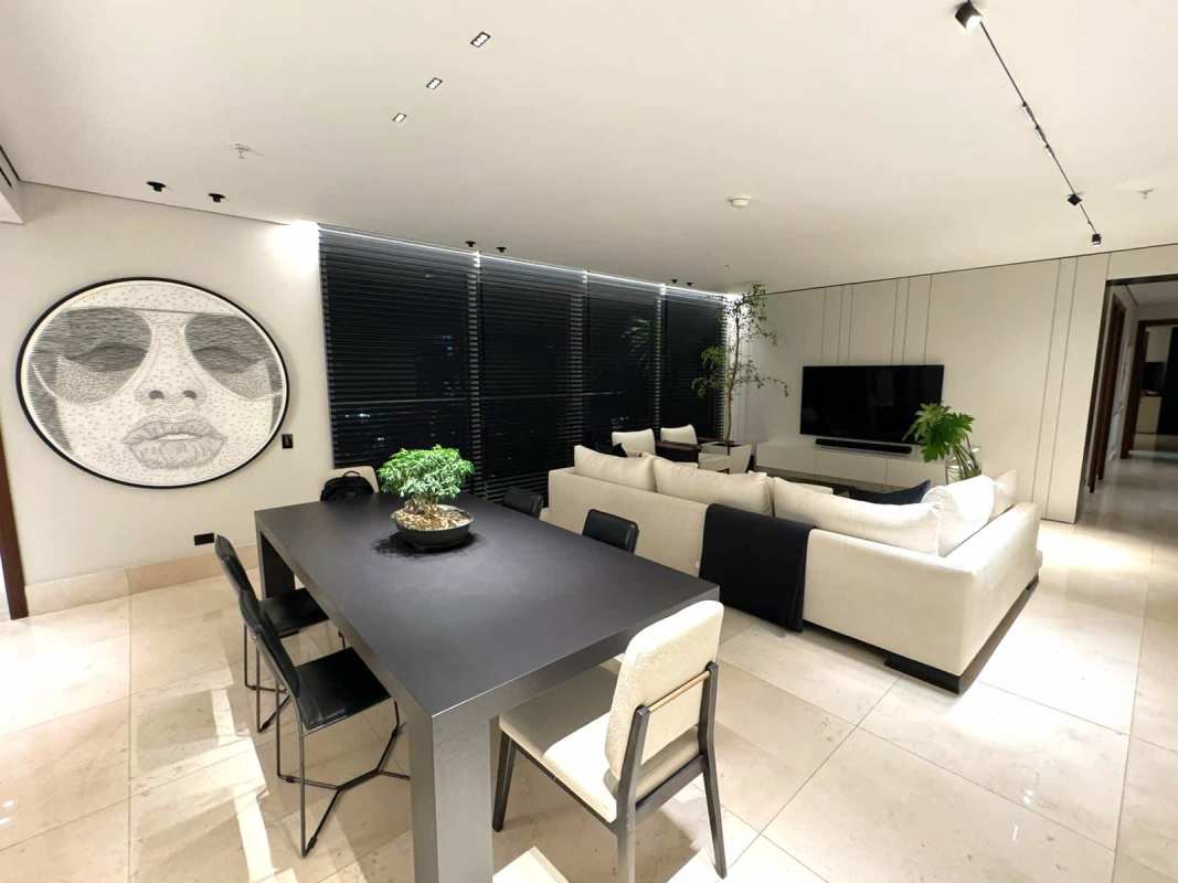 Minimalist open concept living room with city view at PH Wind Rose Panama City