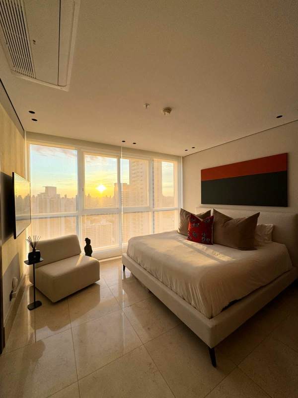 Bedroom with sunset ocean city panoramic views at PH Wind Rose Coco del Mar Panama