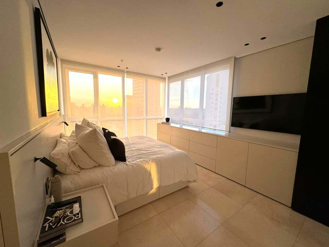 Bedroom with large window of skyline panoramic sunset view PH Wind Rose Panama
