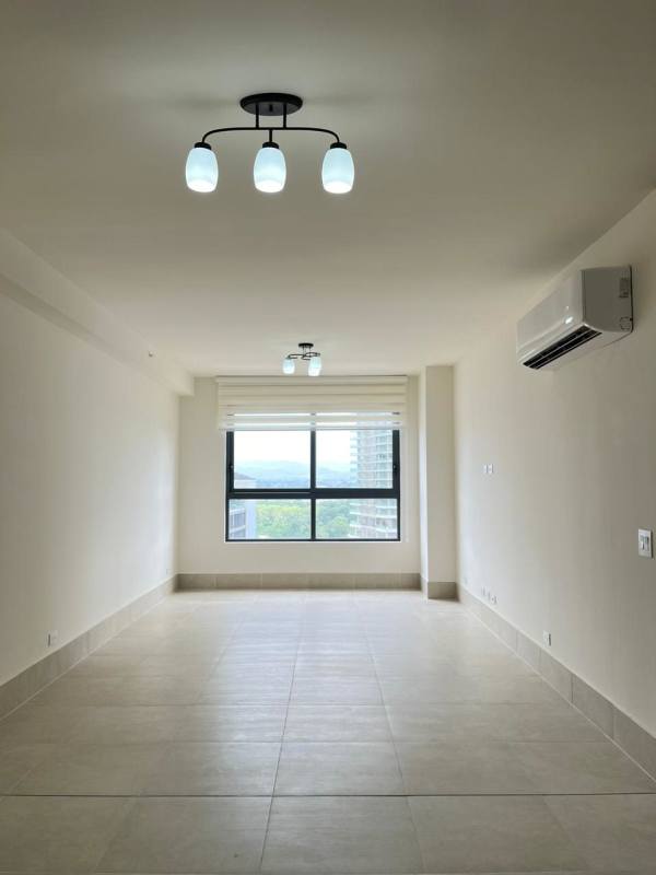 Spacious living and dining area with large window and golf view in Ocean House Santa Maria Panama