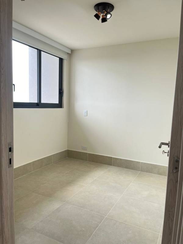 Modern master bedroom with golf views and ensuite bath in Ocean House Santa Maria Panama