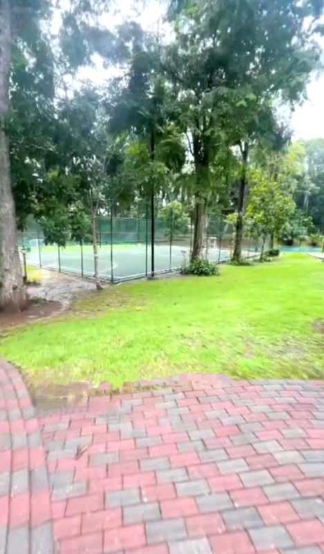 Large covered patio with stone columns and garden view in Senderos Camino de Cruces house Clayton Panama