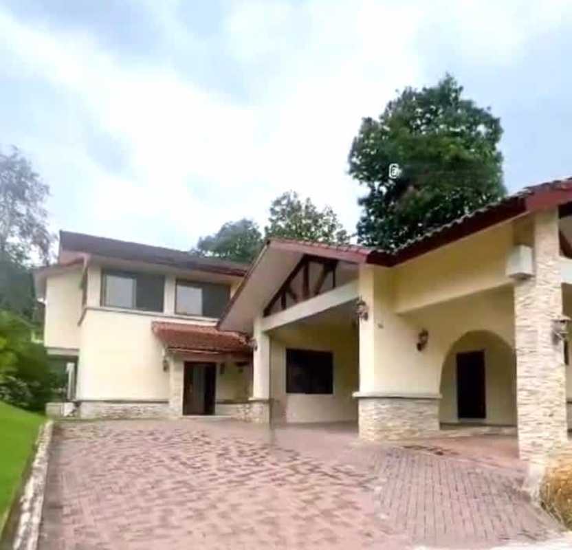 Two-story luxury home with tile roof, large windows and Mediterranean design at Senderos Camino de Cruces