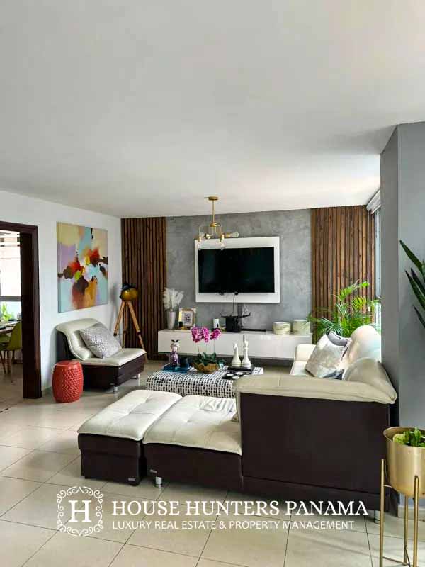 Spacious living room with city views tile floors at PH Sol Marina Marbella apartment Panama