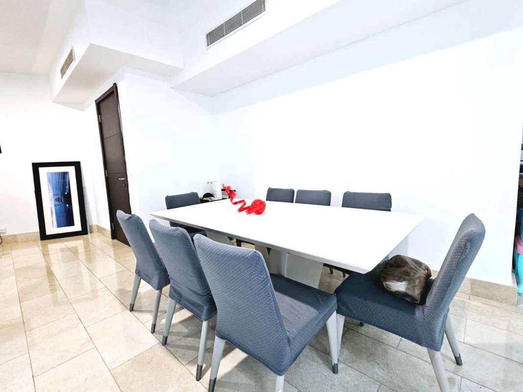 Large bedroom with floor-to-ceiling ocean and city views in Grand Tower Panama