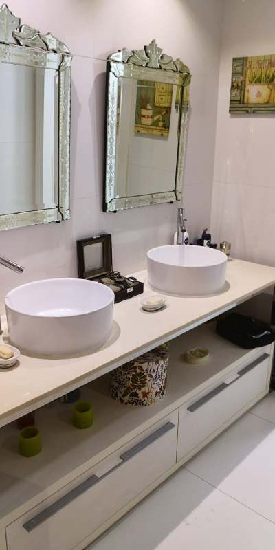 Modern bathroom with double vessel sinks, designer mirrors, and elegant fixtures in PH YOO Panama