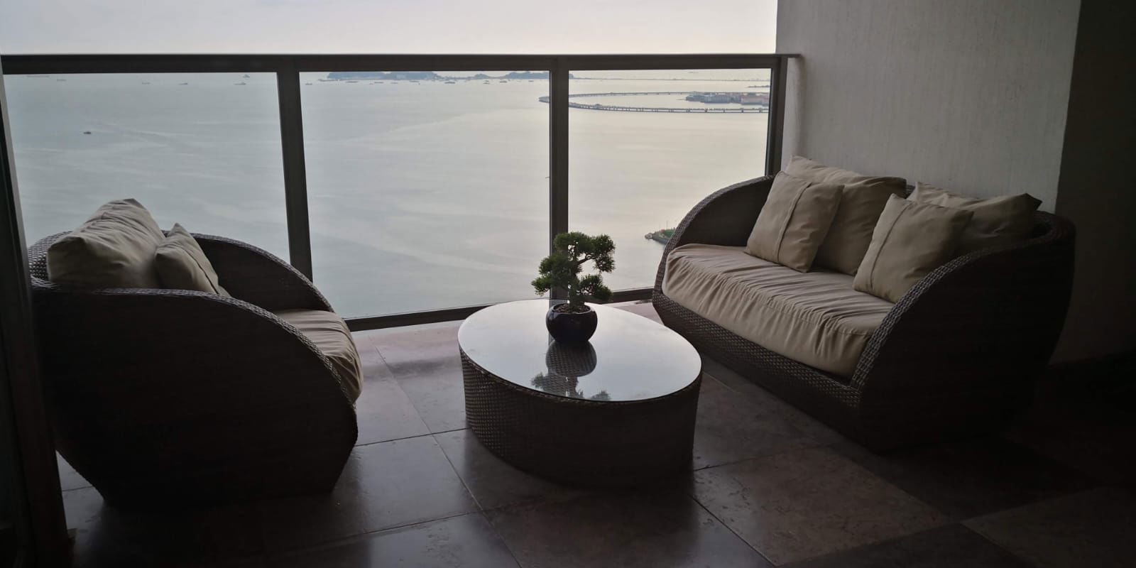 Balcony lounge with panoramic waterfront views at PH YOO Panama luxury residence