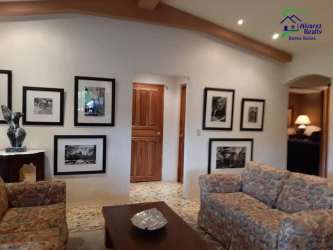 Large open grass pasture area with mature trees on farmland in Renacimiento Chiriquí Panama