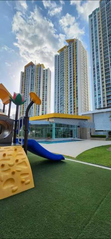 PH Kings Park with children's playground and residential high-rise towers in Condado del Rey Panama City