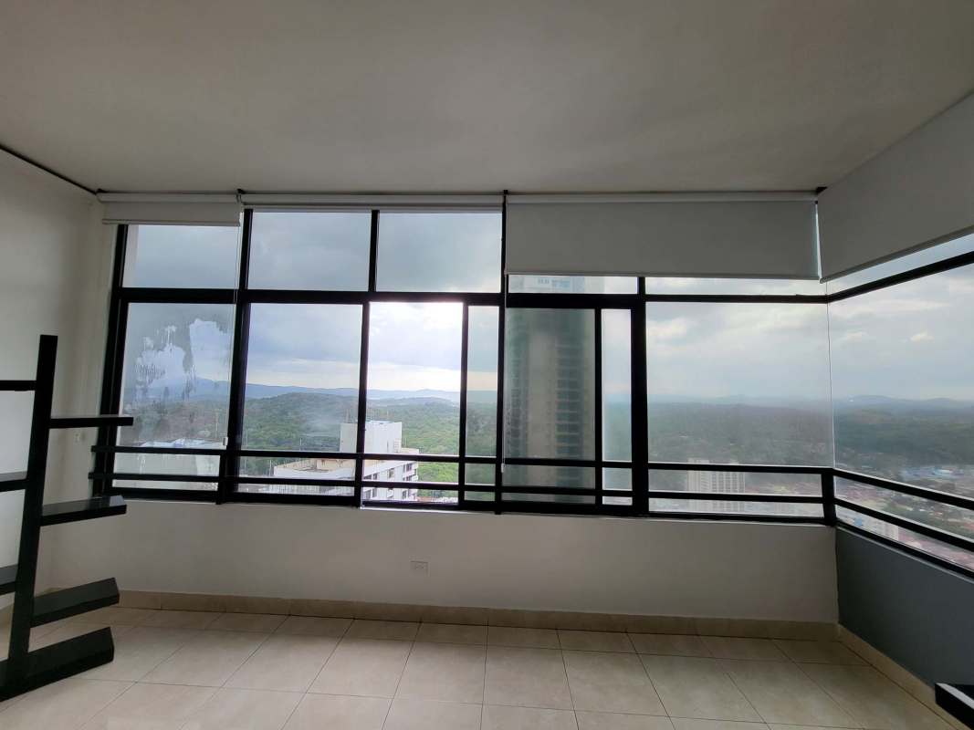 Furnished bedroom with large window and view over Panama Canal at PH Pacific Hills Dos Mares
