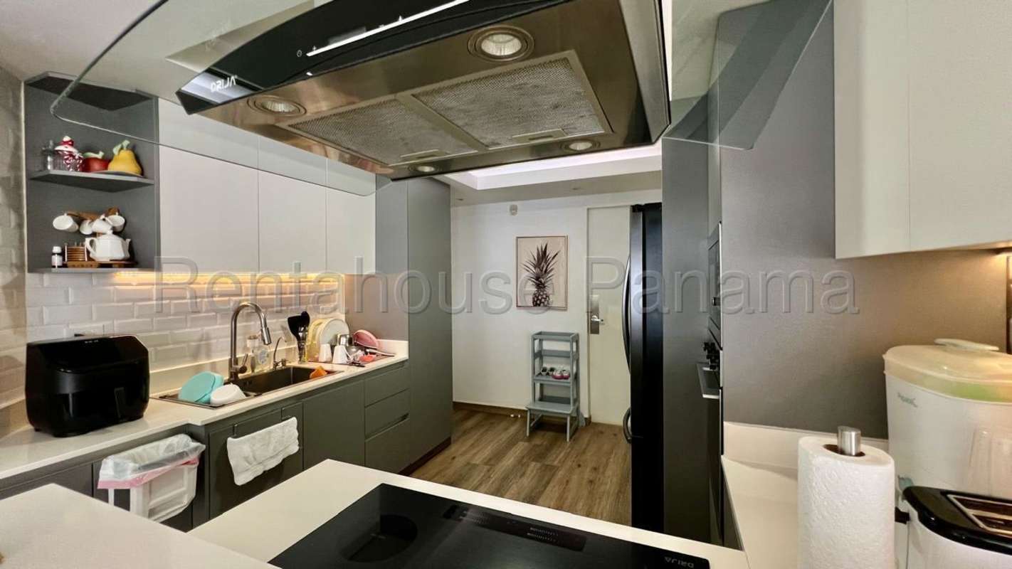 Remodeled open kitchen with granite counters and appliances in Albrook Panama home