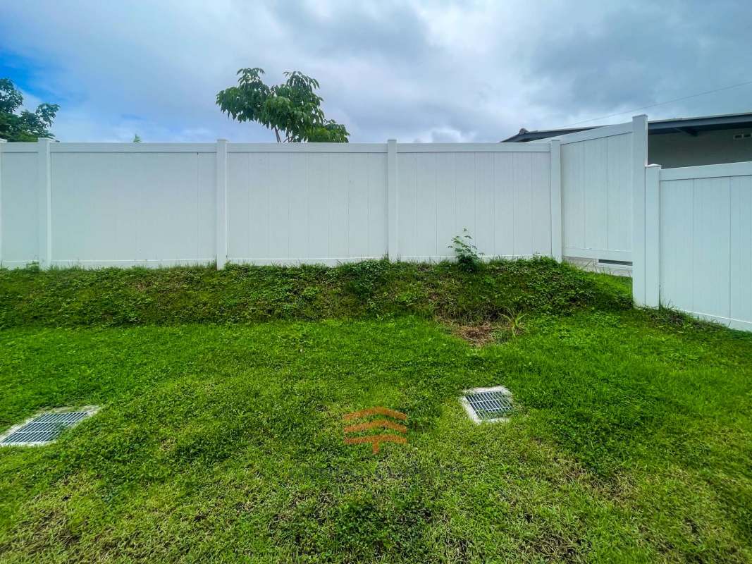 Bright bedroom with large window and built-in closet in new Costa Sur house Panama