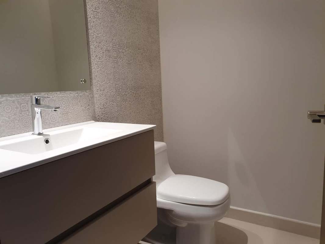 Gourmet kitchen with granite countertops, stainless appliances, breakfast bar in Casa Bianca Panama City