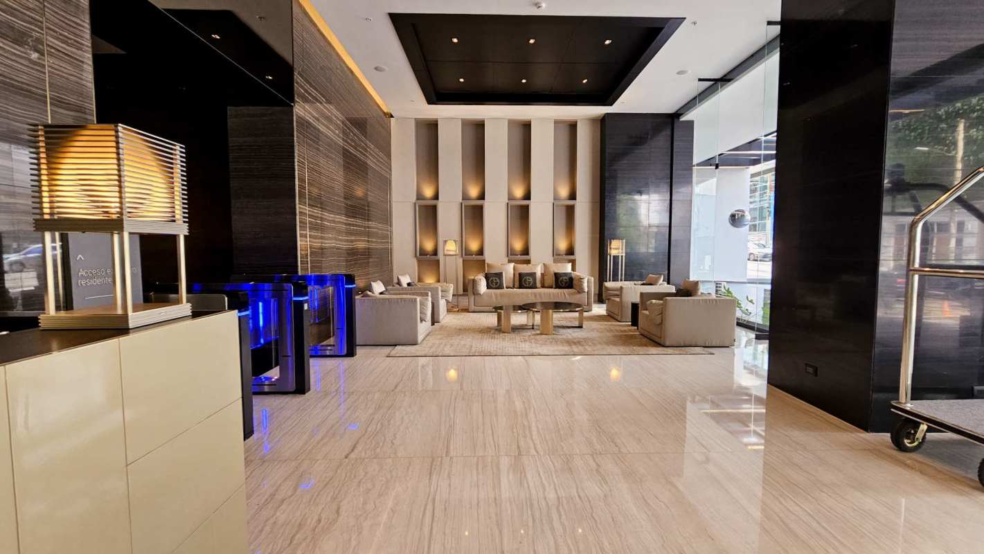 Infinity pool overlooking ocean, high-rise buildings and lounge area at PH BICSA Panama