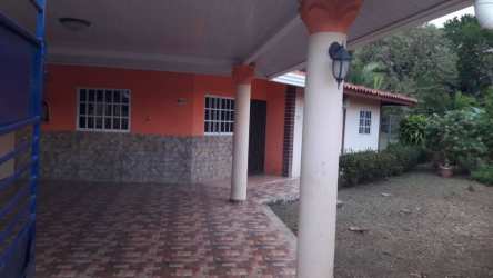 Covered patio area with columns tiled floor garden traditional Panama house