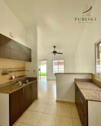 Open kitchen with granite countertops in house at La Arboleda Costa Verde Panama