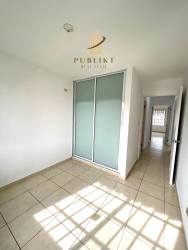 Spacious fenced backyard with green lawn and palm tree in La Arboleda Costa Verde Panama