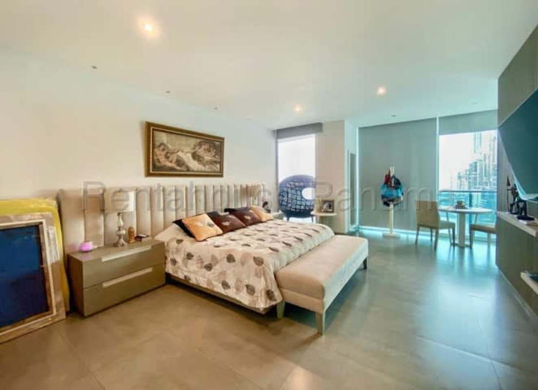Master bedroom with large windows and ocean skyline view PH Aquamare Punta Pacifica