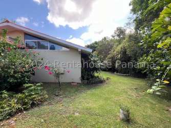 Exterior garden with tropical plants, flowers, trees around house in Vista Alegre Arraiján Panama