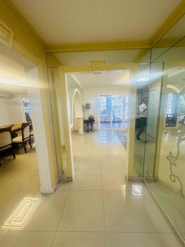 Dedicated workspace with shelving and AC in family rental house Tumba Muerto Panama