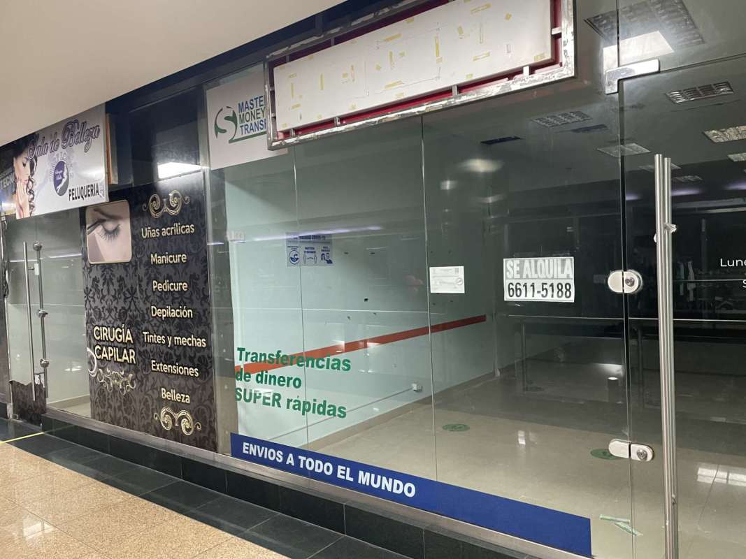 Vacant commercial retail unit with glass door and signage space inside El Dorado Super Center Panama