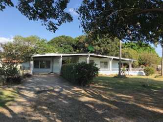 Open rustic land area with tree shade fence rural Penonomé Coclé Panama property