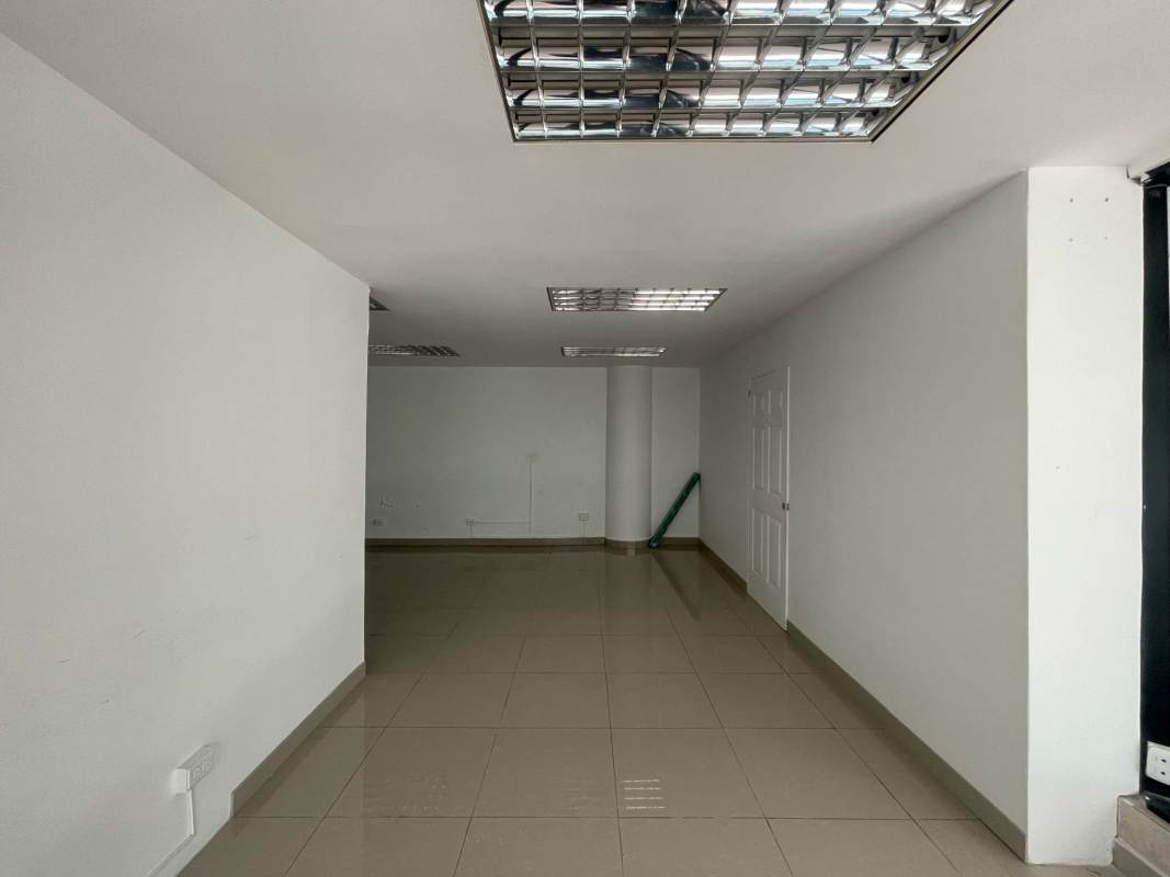 Blank interior commercial office space with tiled floors and white walls in PH Dorado Mall El Dorado Panama