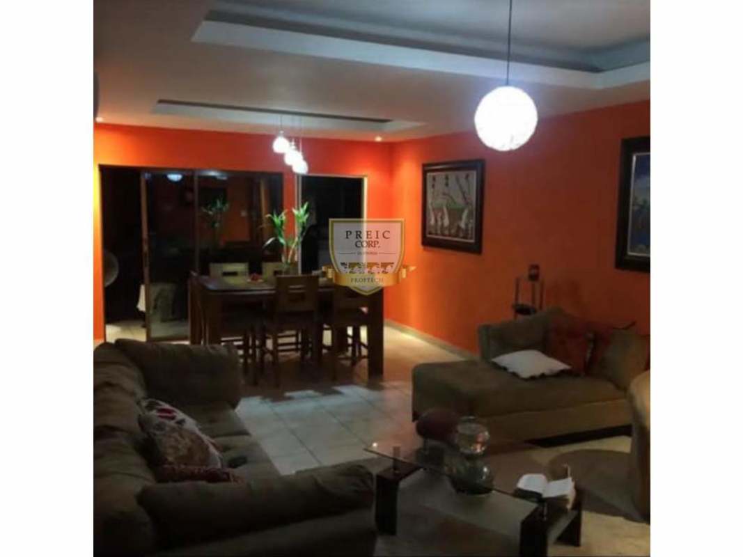 Modern open living dining with sliding door and globe lights Panama house for sale