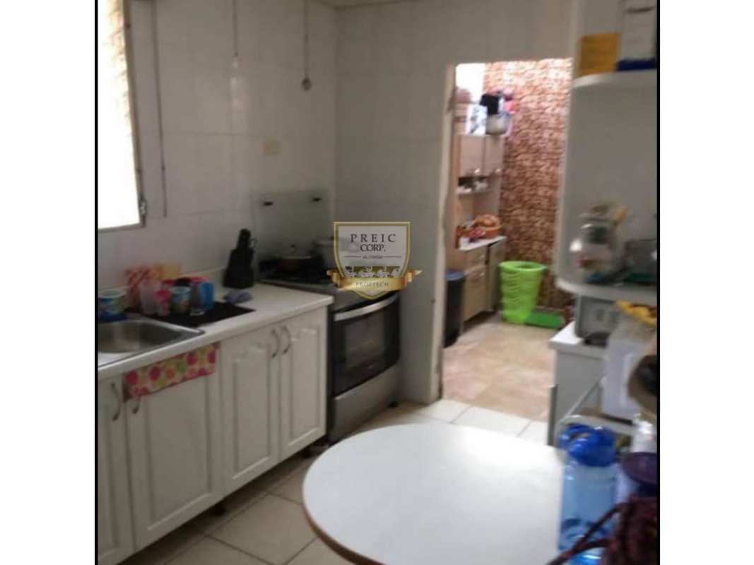 Outdoor small pool with blue border and turf in backyard Panama house