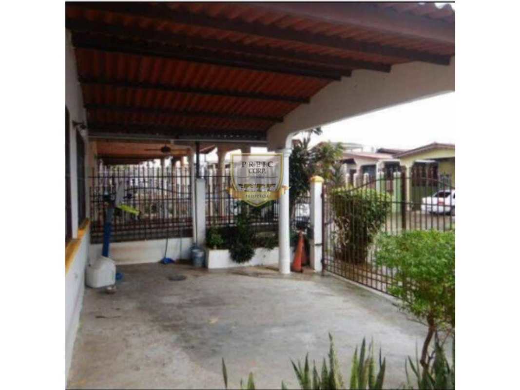 Outdoor patio bar area covered with seating hammock and umbrella in Panama suburban house