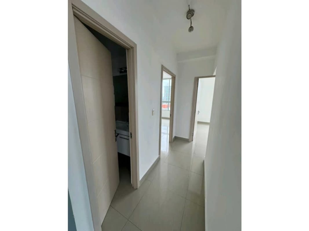 Wide hallway with tiled floors connecting bedrooms and living area in PH San Francisco Bay Panama