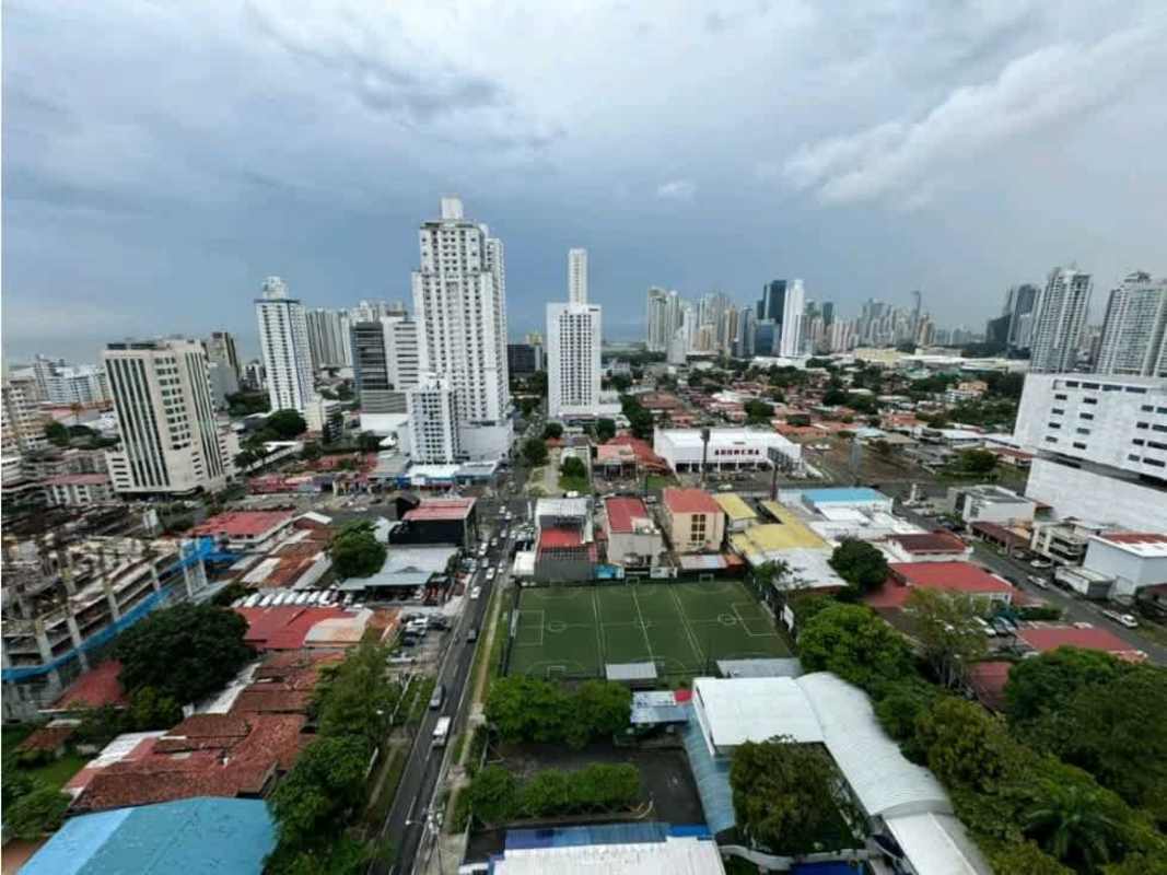 Aerial city skyline with highrises and view of Parque Omar in Panama City San Francisco district