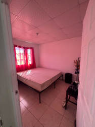 Bedroom with bunk bed, simple decor, natural light in affordable Playa Leona house Panama Oeste