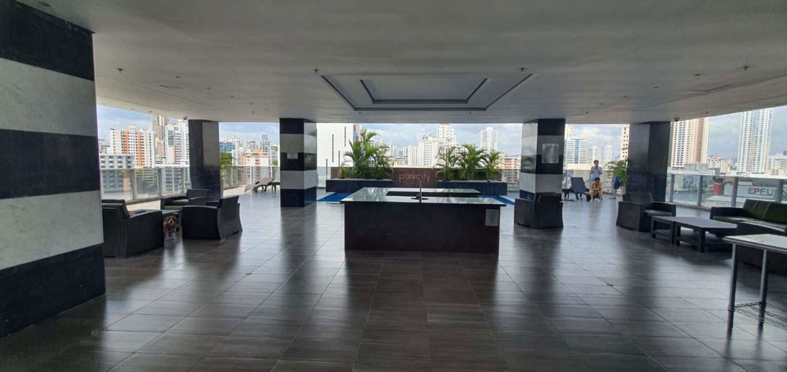 Open concept kitchen living dining with large windows in Obarrio apartment Panama