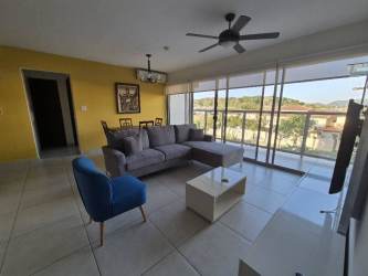 Spacious living room with balcony, natural light, furnished in PH Midrise Panama Pacifico