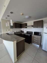 Kitchen with granite counters, appliances, modern cabinetry PH Midrise Panama Pacifico