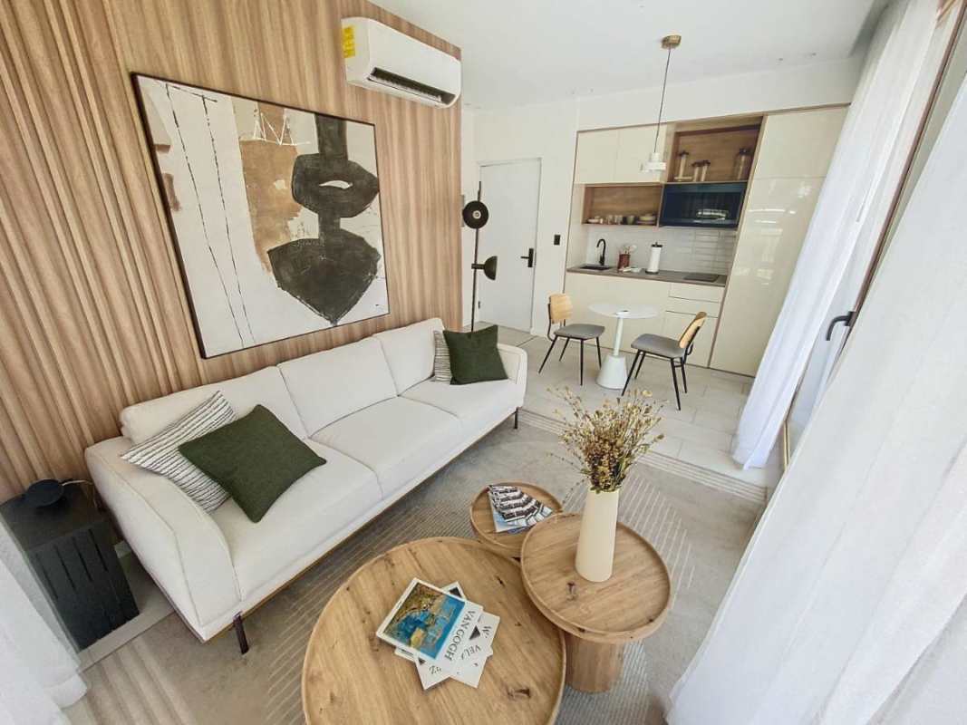 Compact kitchen with subway tiles and dining space in Nook Residences Panama City