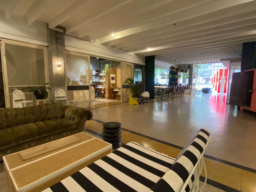 Large industrial-style open commercial space with exposed beams windows Edificio Heurtematte Casco Viejo