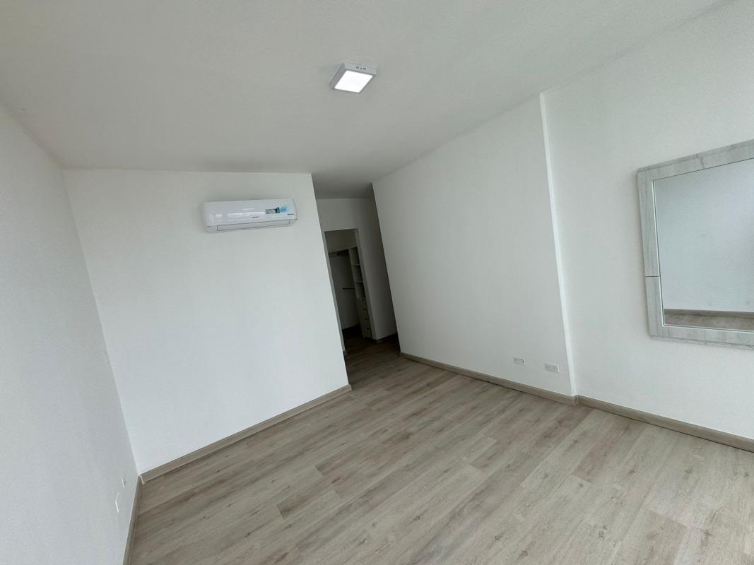 Living and dining area with balcony and city views in PH The Cosmopolitan San Francisco Panama