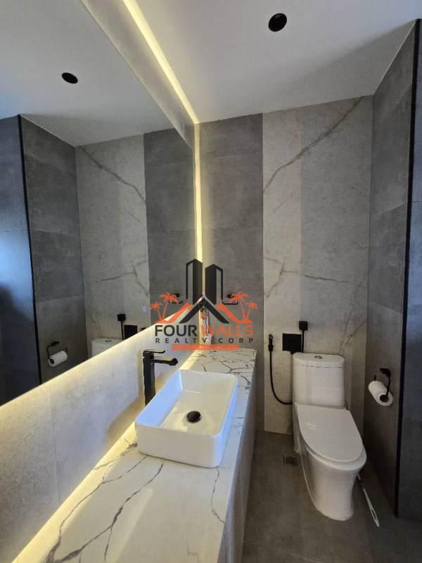 Large master bedroom with panoramic ocean view windows in PH Q Tower Punt Pacifica Panama