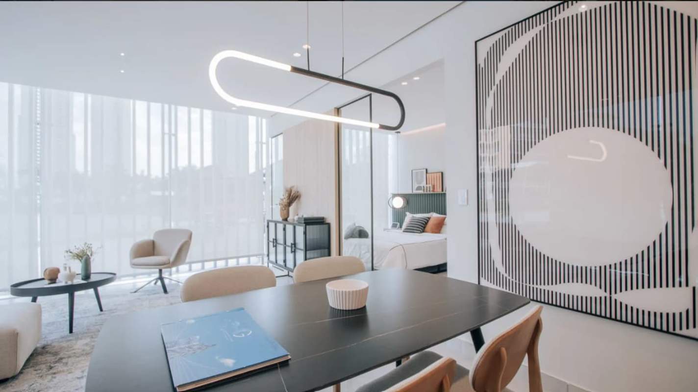 Modern open kitchen and dining area in furnished condo suite PH Uptown Panama