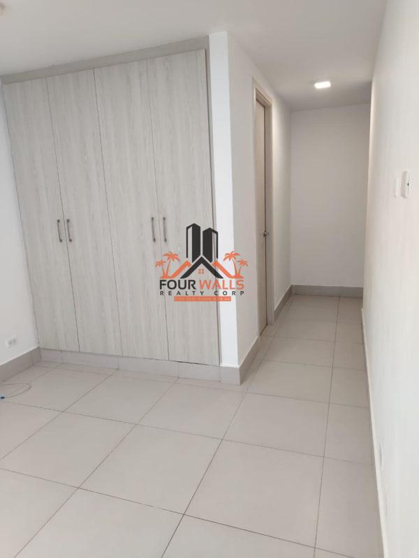 Contemporary kitchen with granite countertops and dark cabinetry in PH Skypoint Tower Panama