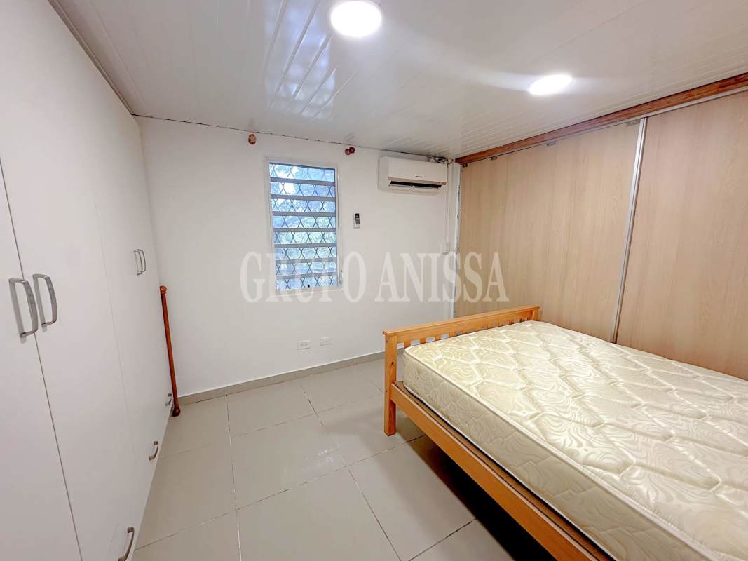 Compact workspace or study area inside Ancón Canal Zone studio rental