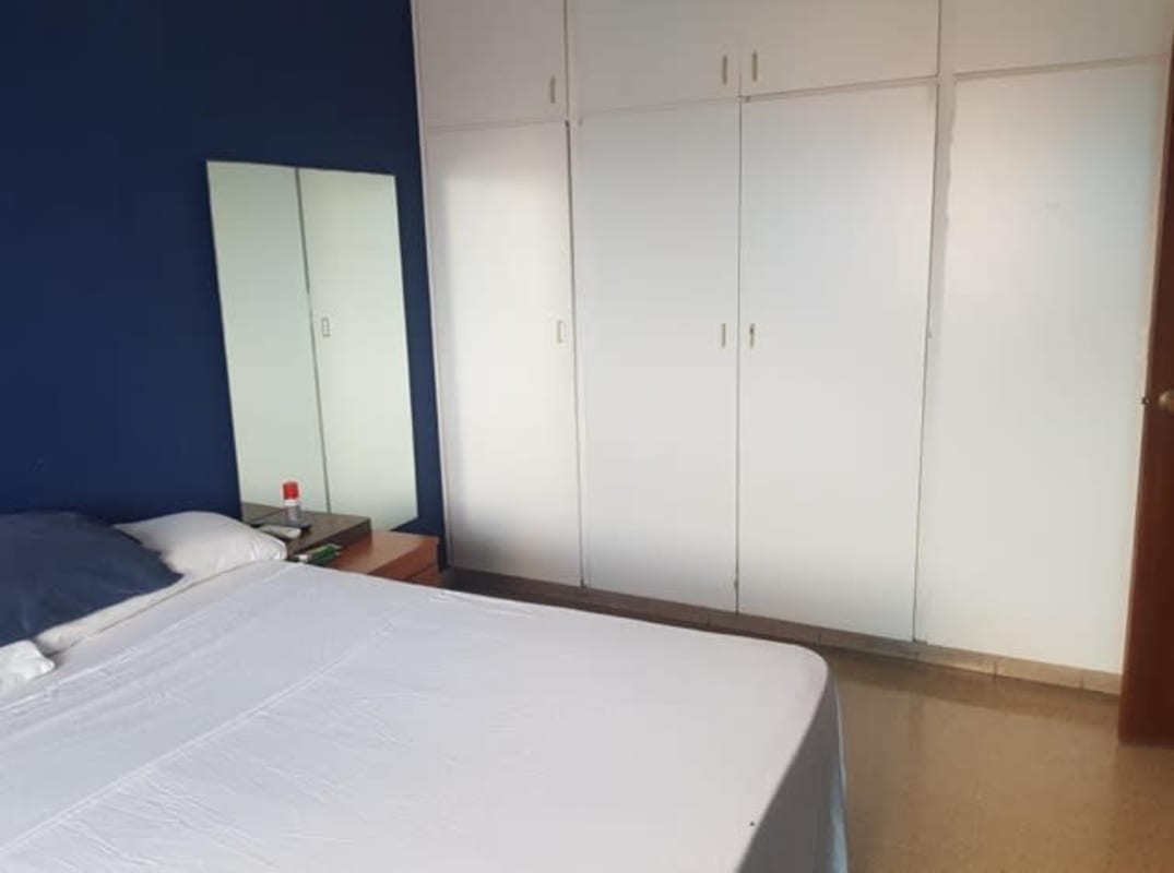 Traditional dining room with mirror wall green walls PH Anayansi Bella Vista