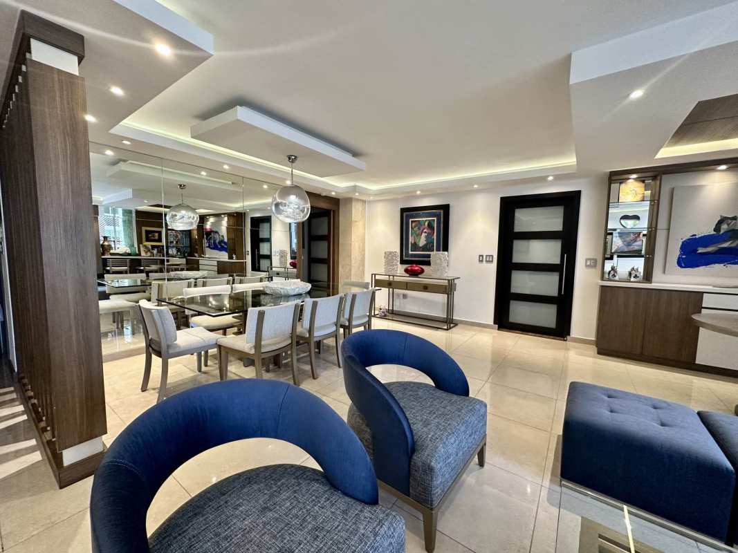 Luxury condominium lobby with seating area chandelier and security at PH Sophia Tower Obarrio Panama