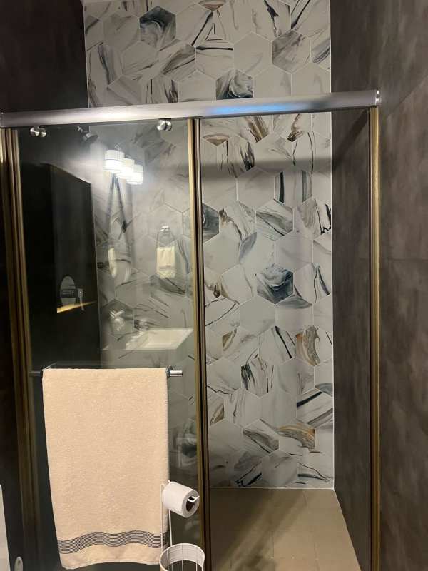 Contemporary bathroom with glass shower and modern vanity PH Sophia Tower Obarrio Panama City