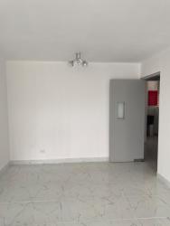 Spacious living and dining area with gray tile floors, bright walls, balcony access in PH Dorado Tower El Dorado Panama